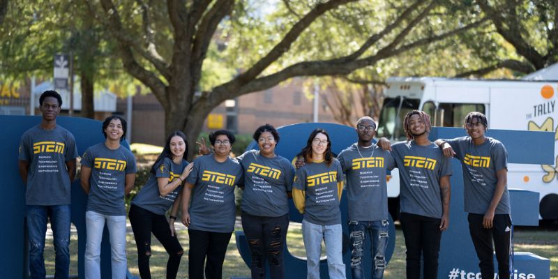 Stem students posing under a tree