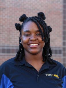 A young woman smiling