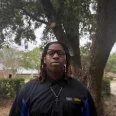 A young man standing